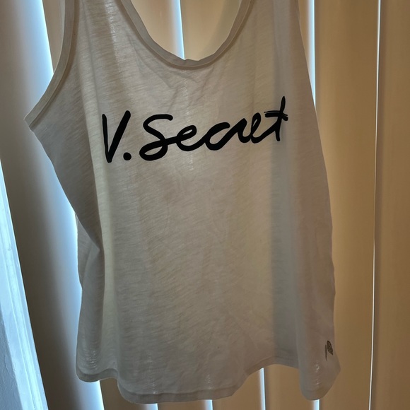 A white tank top from Victoria’s Secret. This is a size medium. - Picture 1 of 3